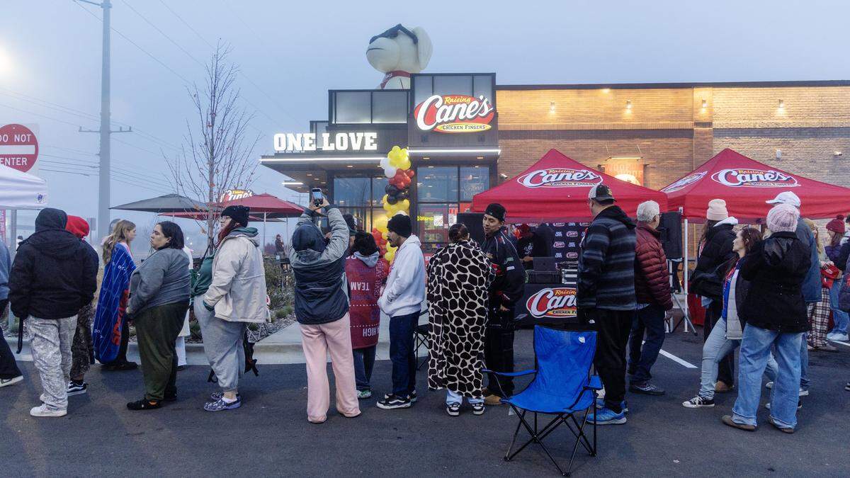 Customers form a line outside for the grand opening of Raising Cane's first Idaho location on Eagle Road in Meridian, Tuesday, Nov. 18, 2025.