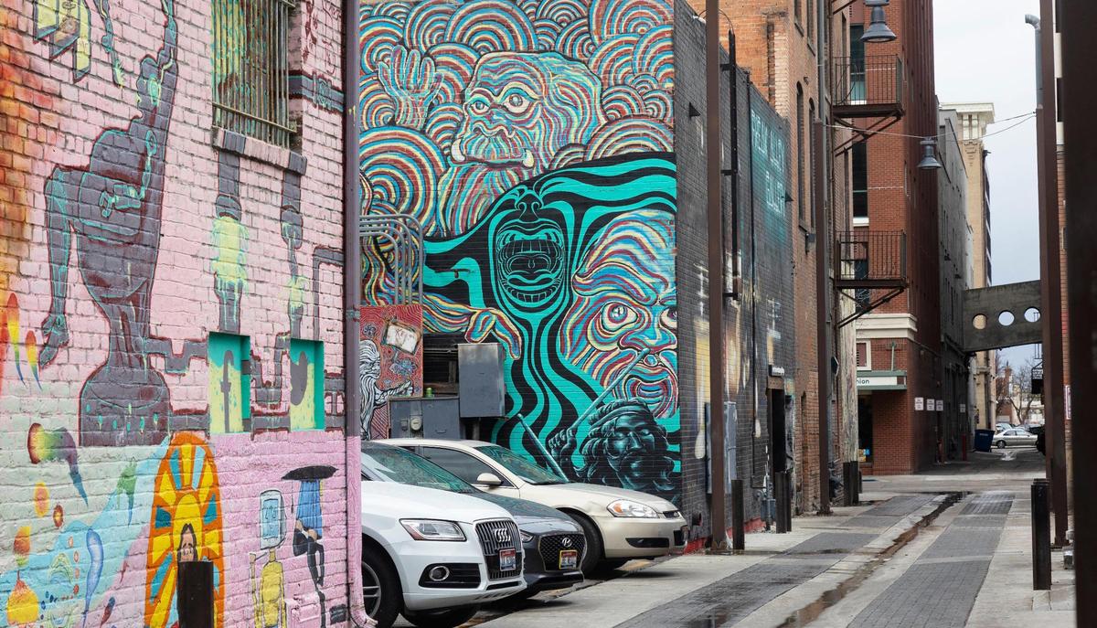 Graffiti-style art lines the walls of Freak Alley Gallery.
