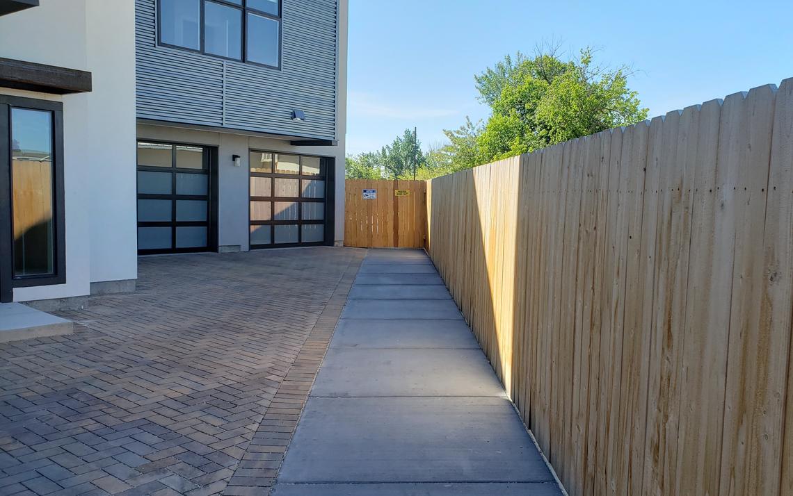 The fence at the end of this walking path at the Waterhouse Row townhouses blocks access to the Greenbelt from 35th Street in Garden City. Previously, pedestrians and bicyclists could access the Greenbelt and 35th Street from there.