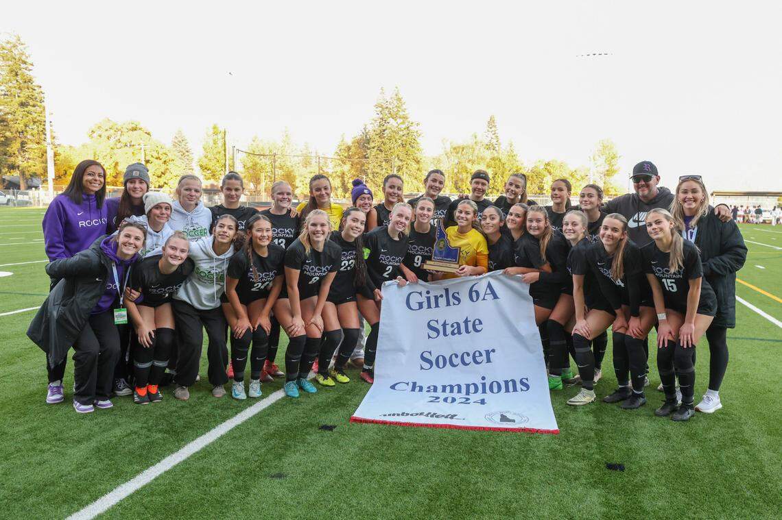 The Rocky Mountain girls soccer team poses with the 6A state championship banner after beating Boise 5-4 in penalty kicks after a scoreless draw Saturday at War Memorial Field in Sandpoint.