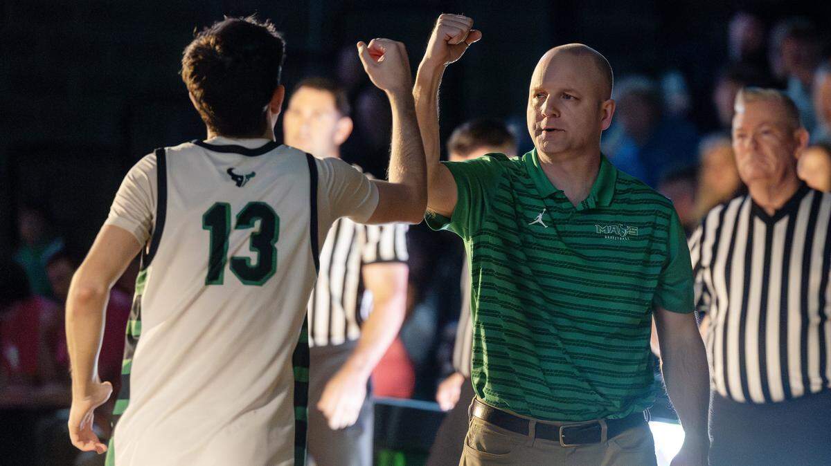 Mountain View varsity boys basketball coach Jon Nettleton greets senior Zach Smith as the starters are announced during their game at home against Eagle, Friday, Jan. 30, 2026. Nettleton is retiring at the end of the season after 21 years coaching the Mavericks.