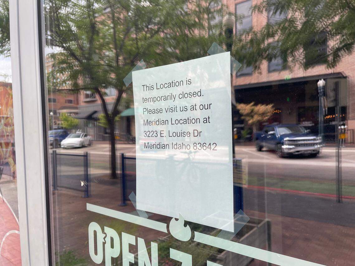 A sign on the door at Clucks in downtown Boise on Wednesday indicated that it was temporarily closed.