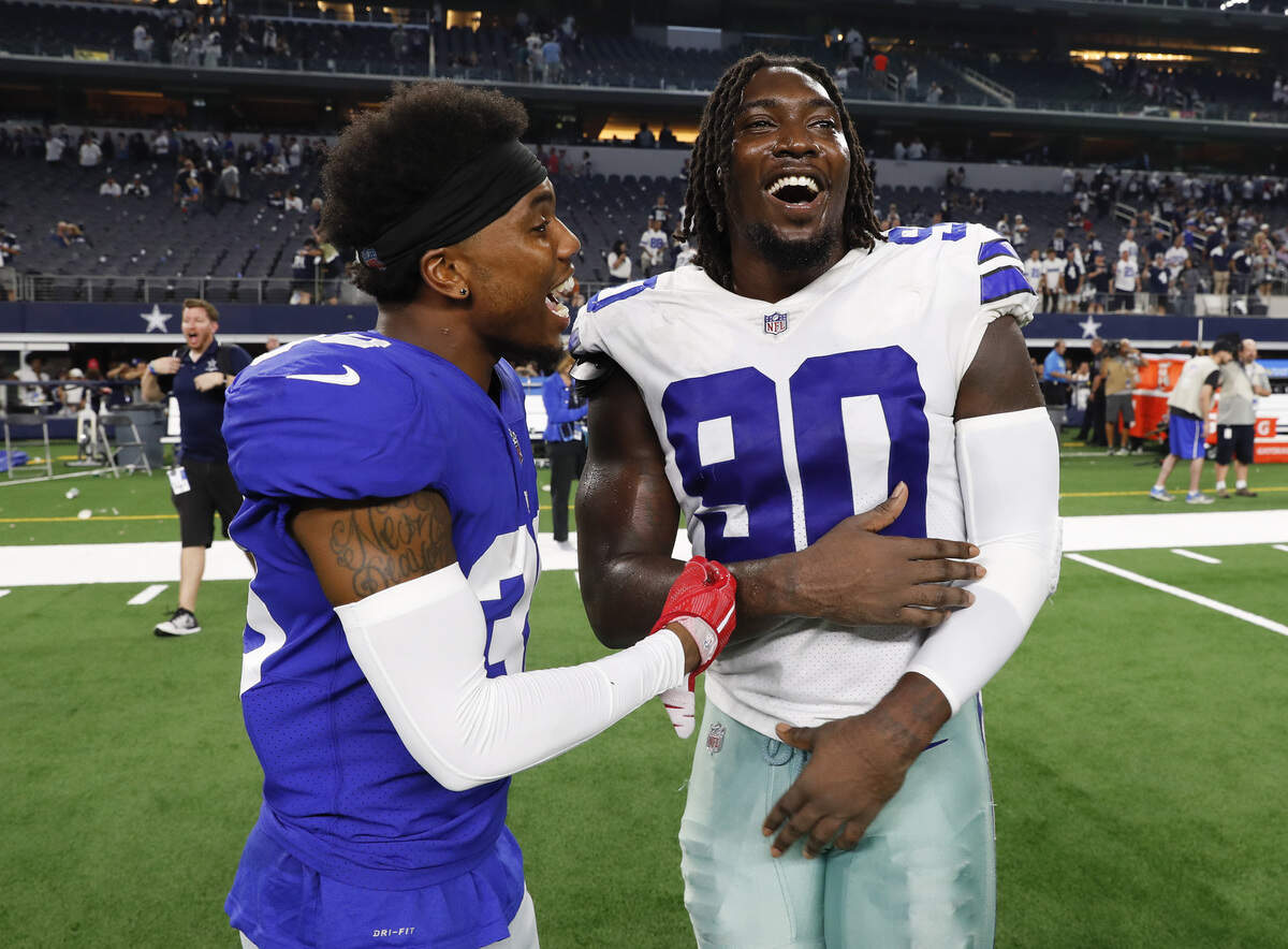 New York Giants cornerback Donte Deayon (38) and Dallas Cowboys defensive end DeMarcus Lawrence (90) talk after the game on Sunday, Sept. 16, 2018, at AT&T Stadium in Arlington, Texas. The Cowboys won 20-13. (Jim Cowsert/Fort Worth Star-Telegram/TNS)