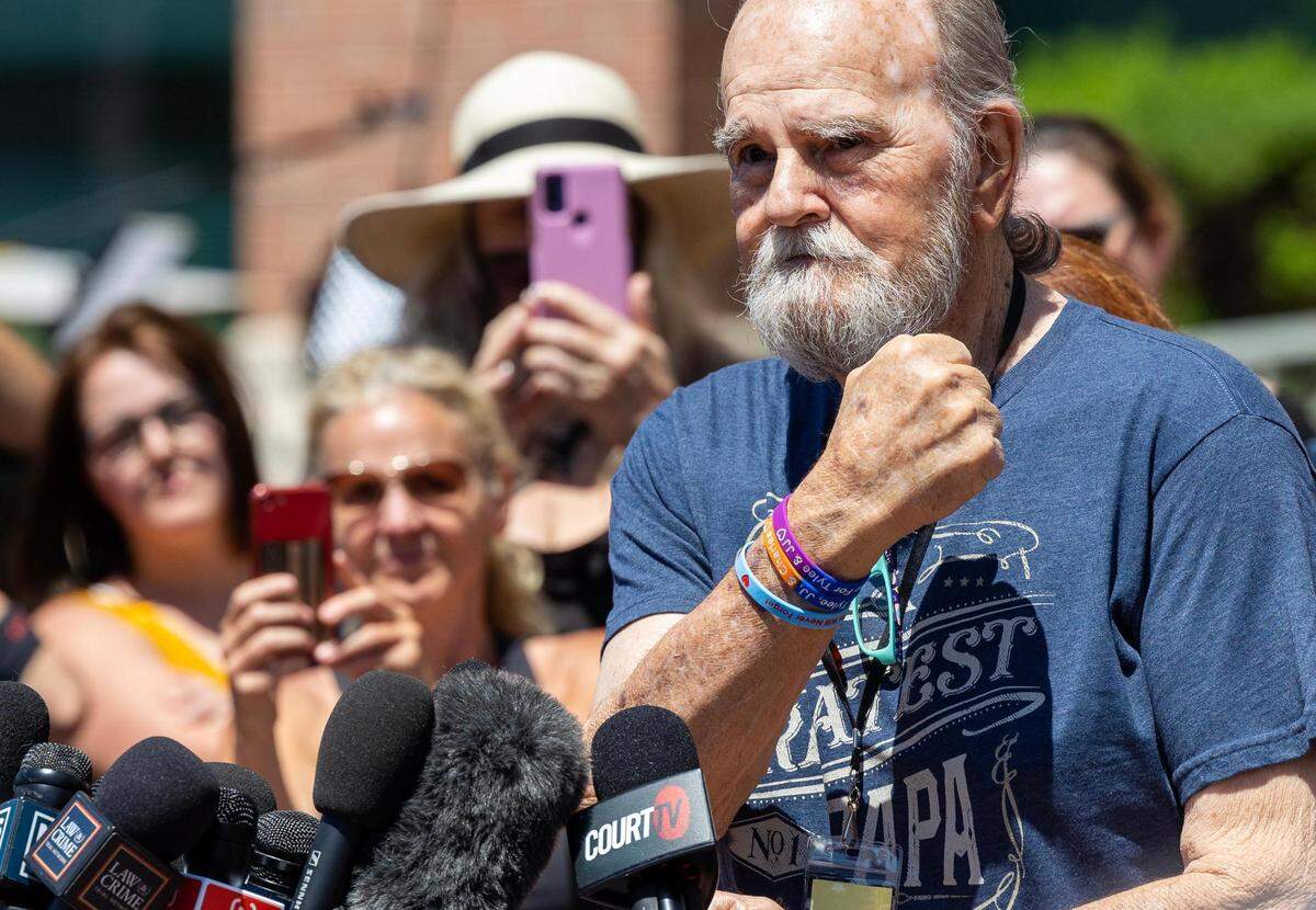 Larry Woodcock holds up his fist showing wristbands in memory of his grandson, JJ Vallow, and JJ’s sibling Tylee Ryan on Friday outside of the Ada County Courthouse. The jury found Lori Vallow Daybell guilty of the first-degree murders of two of her children.