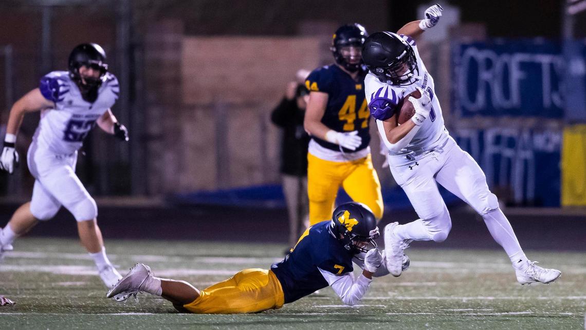 Rocky Mountain running back Jordan Erickson is tripped up by Meridian’s Tristan Martinez at the end of the first half Friday, Oct. 16, 2020 at Meridian High School.