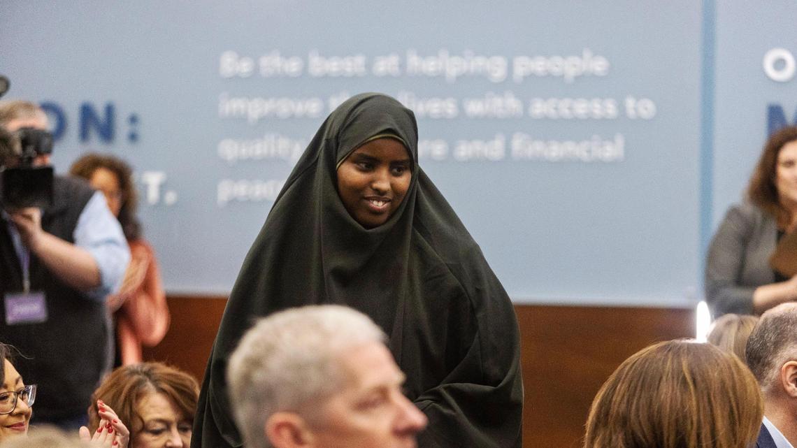 Nimo Abdi is recognized by the audience during a College of Idaho news conference Tuesday announcing the Elgin & Elaine Baylor Opportunity Fund. Abdi is the first student to receive a full-ride scholarship from the fund. 