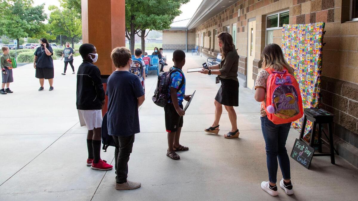 Teachers welcome back students at Morley Nelson Elementary in Boise Monday, Aug. 16, 2021.