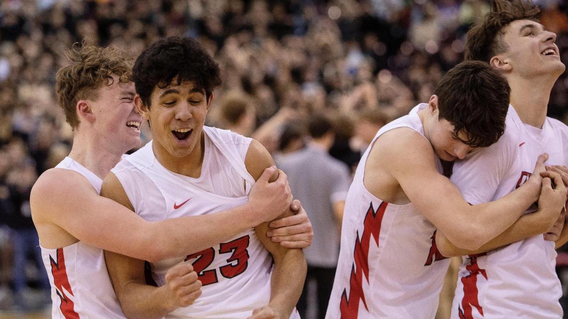 Owyhee’s Barrett Fernandez, left, Titus Bailey, Jackson Rogers and Cameron Downie celebrate after a 50-43 win over Centennial in the the 5A boys basketball state championship game Saturday at the Ford Idaho Center.