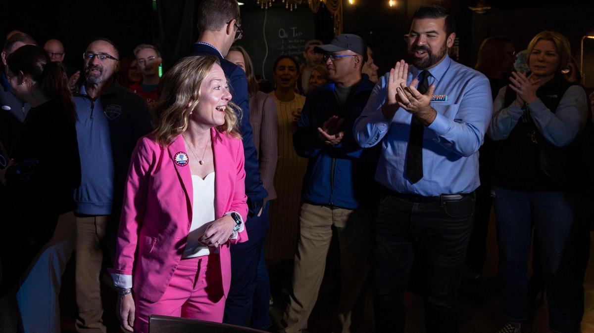 Boise Mayor Lauren McLean is applauded by supporters, including City Council candidate Jordan Morales, right, after arriving to the Election Night party at Lounge at the End of the Universe in Boise.
