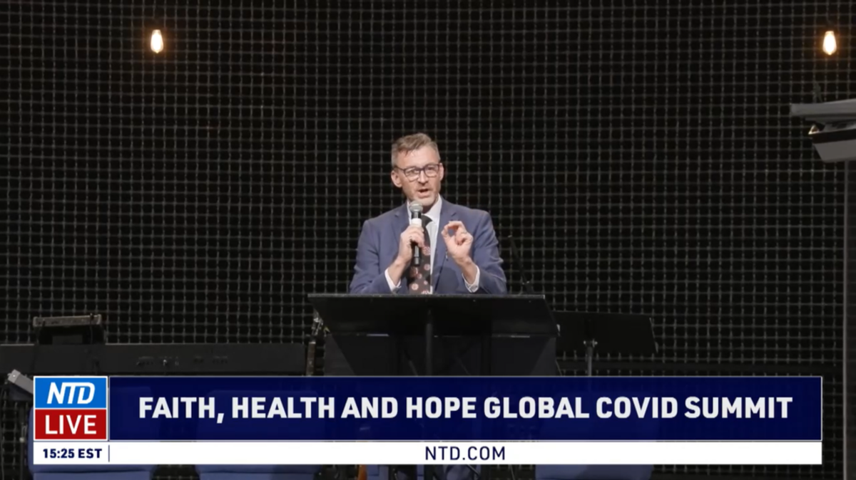 Dr. Ryan Cole speaks at the “Faith, Health and Hope Global COVID Summit” at a church in Grandview, Missouri, last November.