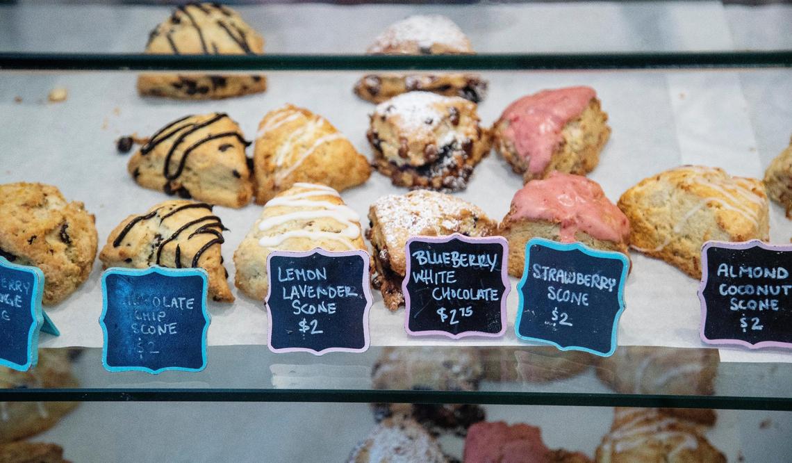 Several varities of scones, including lemon lavender, strawberry and blueberry white chocolate, line the display case at Wildflour Bakery.