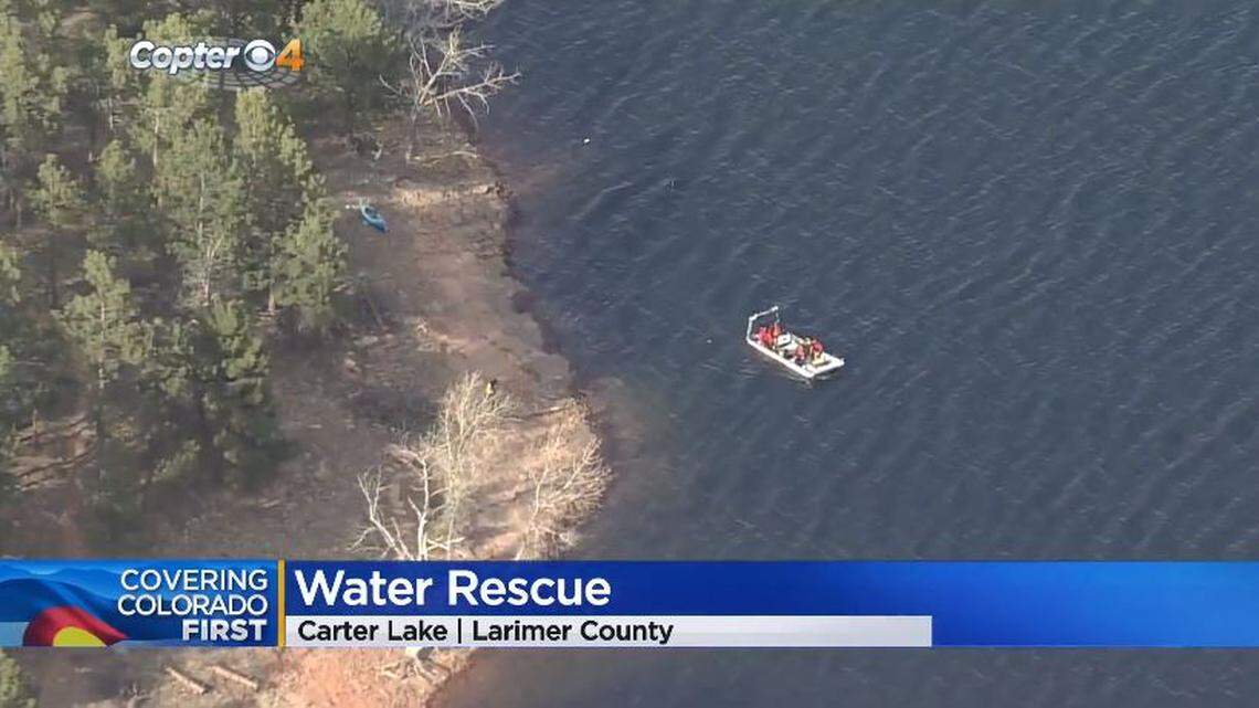 Rangers found a dog wearing a flotation device and a capsized kayak in Carter Lake in Colorado, but the kayaker remains missing, officials say.