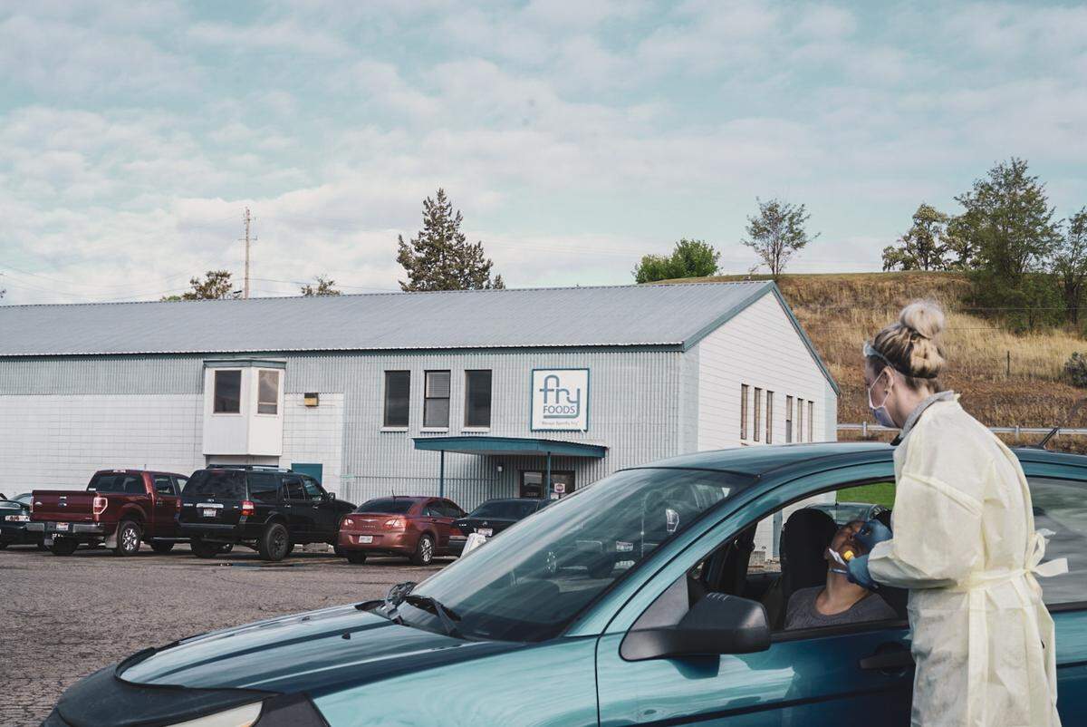 A plant worker at Fry Foods in Weiser gets tested for COVID-19 in his car.