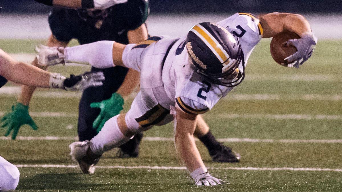 Meridian running back Kross Antonnacchi dives for a first down against Eagle on Friday.