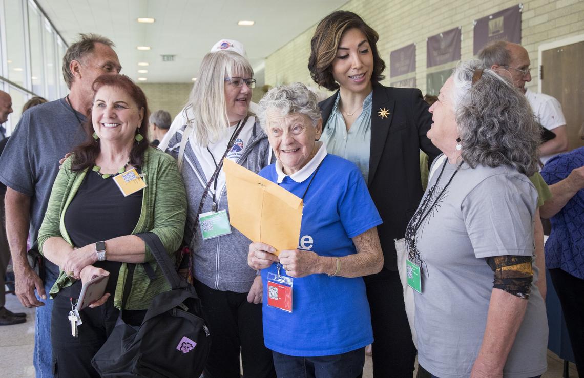 The five delegates from Boundary County (plus a spouse) organize for a photo with Paulette Jordan. 