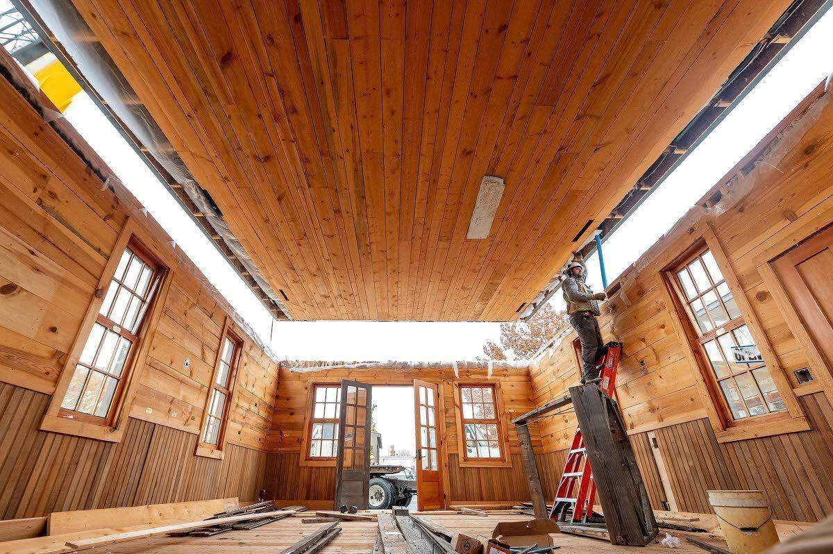 Brian McDermott, owner of Brian McDermott Construction, steadies the roof of the replica of the original Idaho Territorial Capitol at the building’s new home beside the Nez Perce County Historical Society and Museum in Lewiston.