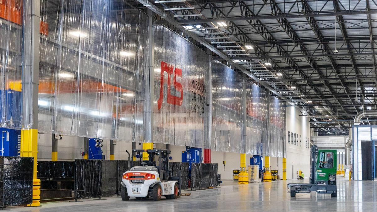 Raw materials come into the plant on one end and completed generator enclosures exit the plant on the other. The exit is pictured on the right.