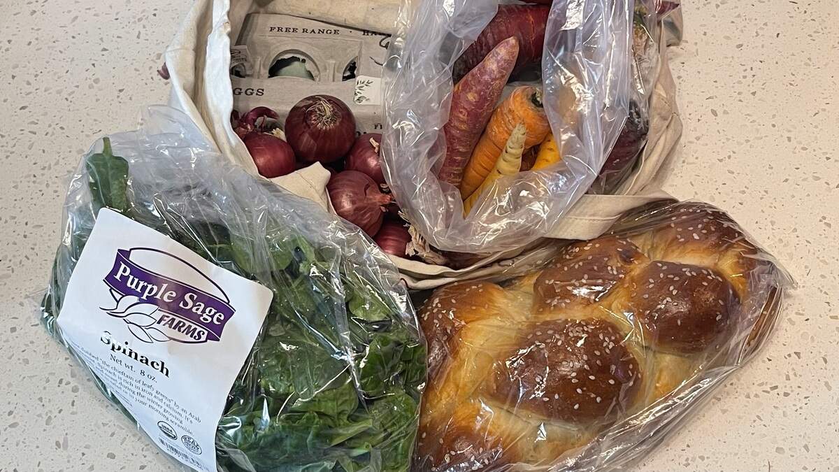 Produce, bread and eggs purchased “on a budget” at the Boise Farmers Market pop-up on Feb. 14.