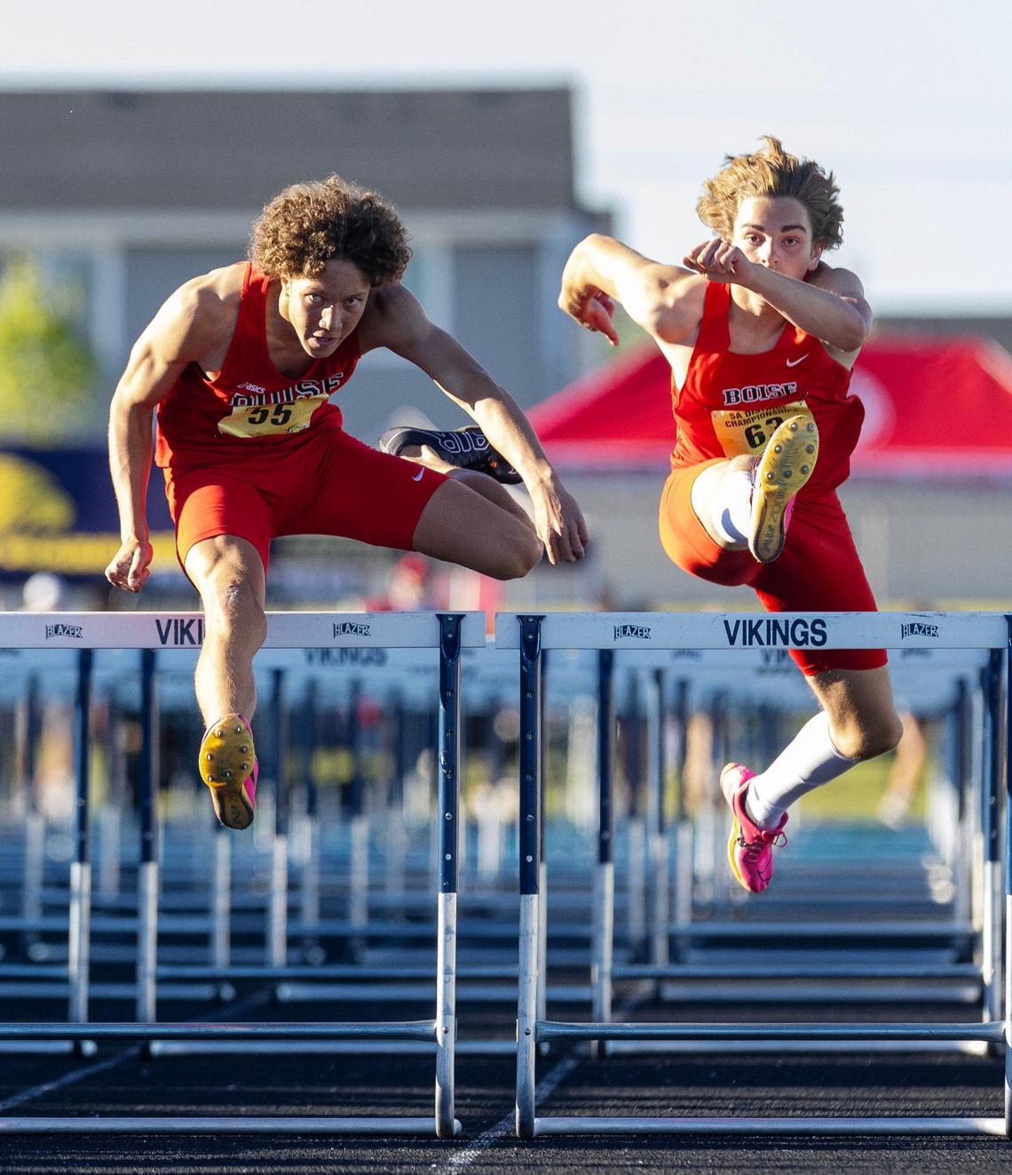 Boise’s Chase Lawyer and William Studebaker II compete in the boys 110-meter hurdles at the 5A District Three Track and Field Championships held Friday at Middleton High School.