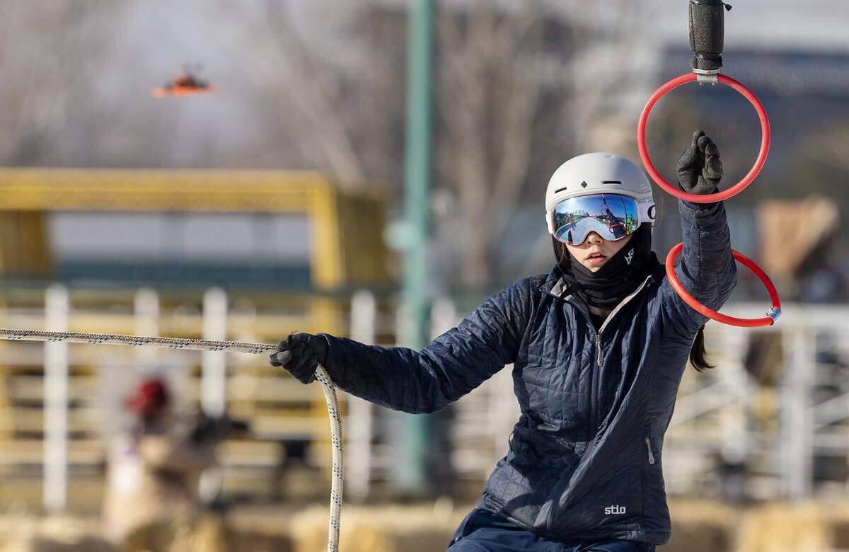 Skier Kamila Rycharska collects rings for team Black Ice in the women's division skijoring competition of Skijor Boise held at the Ford Idaho Center, Friday, Feb. 6, 2026.