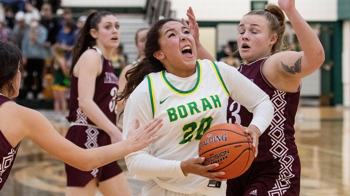 Borah senior Jayden McNeal drives to the basket on Friday against Centennial. She scored 14 points as the Lions topped the Patriots 65-48. 