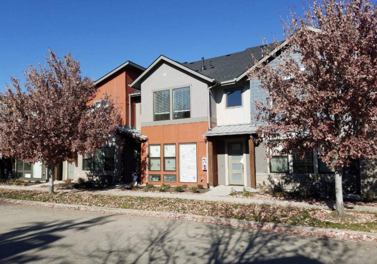 The Pura Vida subdivision would include attached townhouses like these, with garages in the back and front doors facing the sidewalk.
