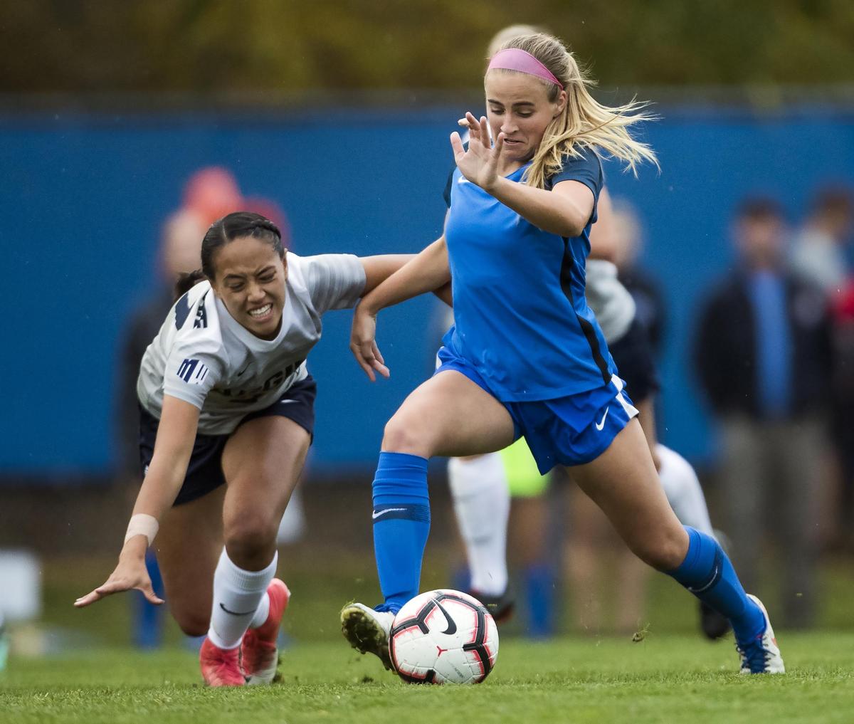Boise State’s Raimee Sherle gets by Utah State’s Mealii Enos for a clear shot, scoring the only goal for the Broncos on Oct. 26, 2018, at the Boas Soccer Complex.