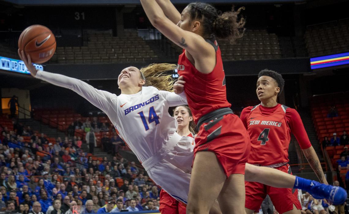 Boise State’s Braydey Hodgins attempts to get past a New Mexico defender on her way to the basket. The Broncos defeated New Mexico 70-66 to clinch the regular-season Mountain West title outright and the No. 1 seed at the conference tournament.