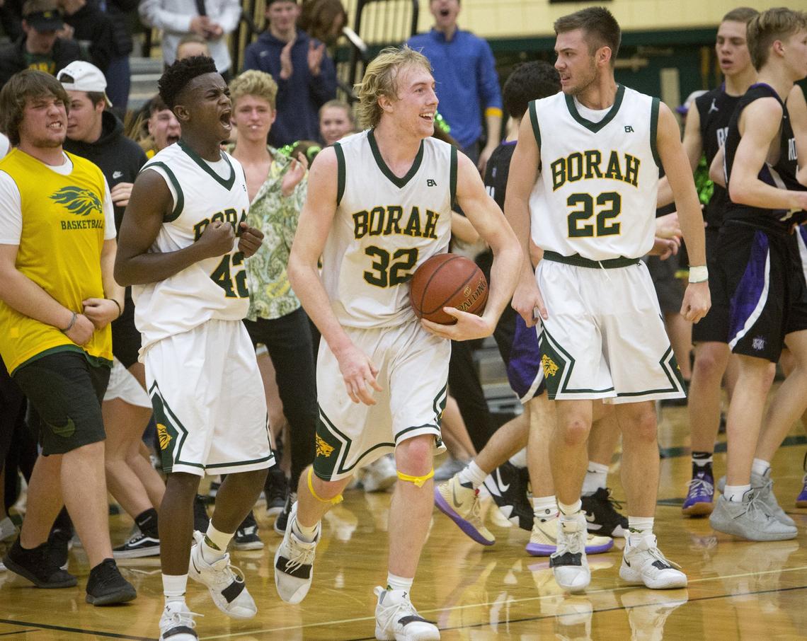 Austi Bolt (32) and DeVaughn Williams (42) celebrate Borah’s 48-46 win against No. 1-ranked Rocky Mountain on Wednesday, Jan. 30, 2019 at Borah.