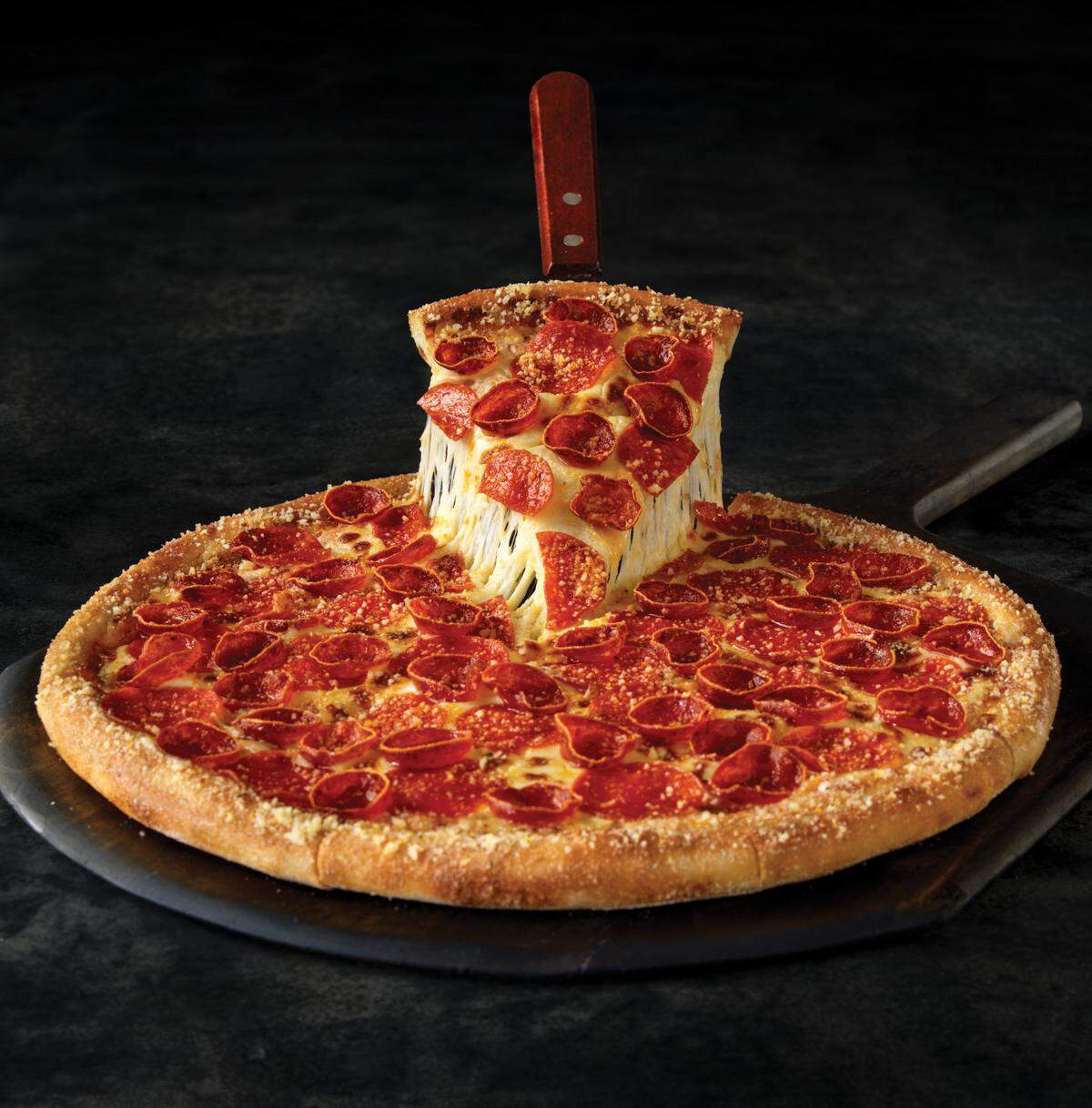 Marco’s Pizza Pepperoni Magnifico is “pepperoni, our signature Old World Pepperoni, romesan seasoning, our original sauce and signature three cheeses,” according to the menu.