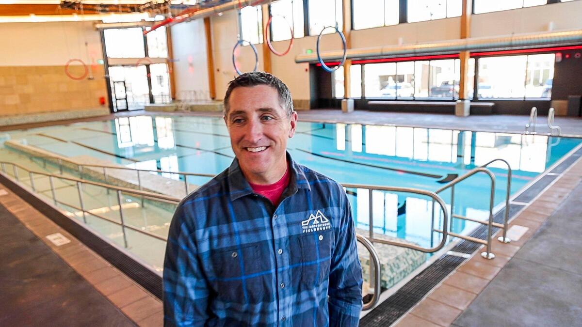 Bryan Madden, director of the Idaho Outdoor Fieldhouse, stands in front of the building’s aquatic center.