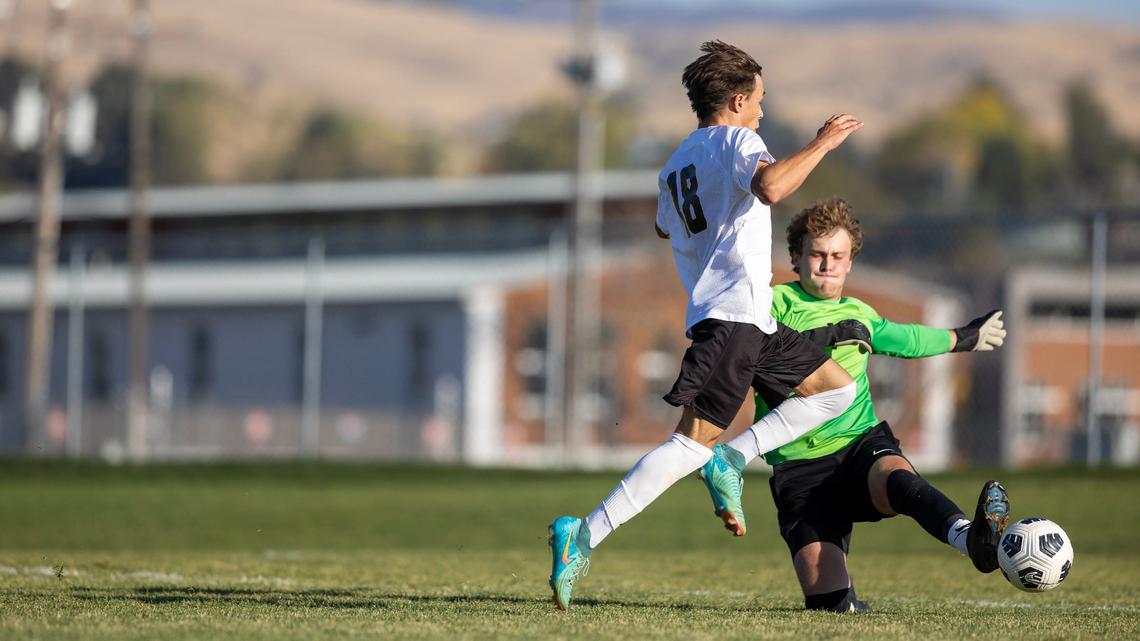 Boise senior goalkeeper senior Travis Bartich kicks the ball away from Bishop Kelly senior Mason Schweitzer. Bartich finished with a clean sheet in the Brave’s 2-0 win over BK.