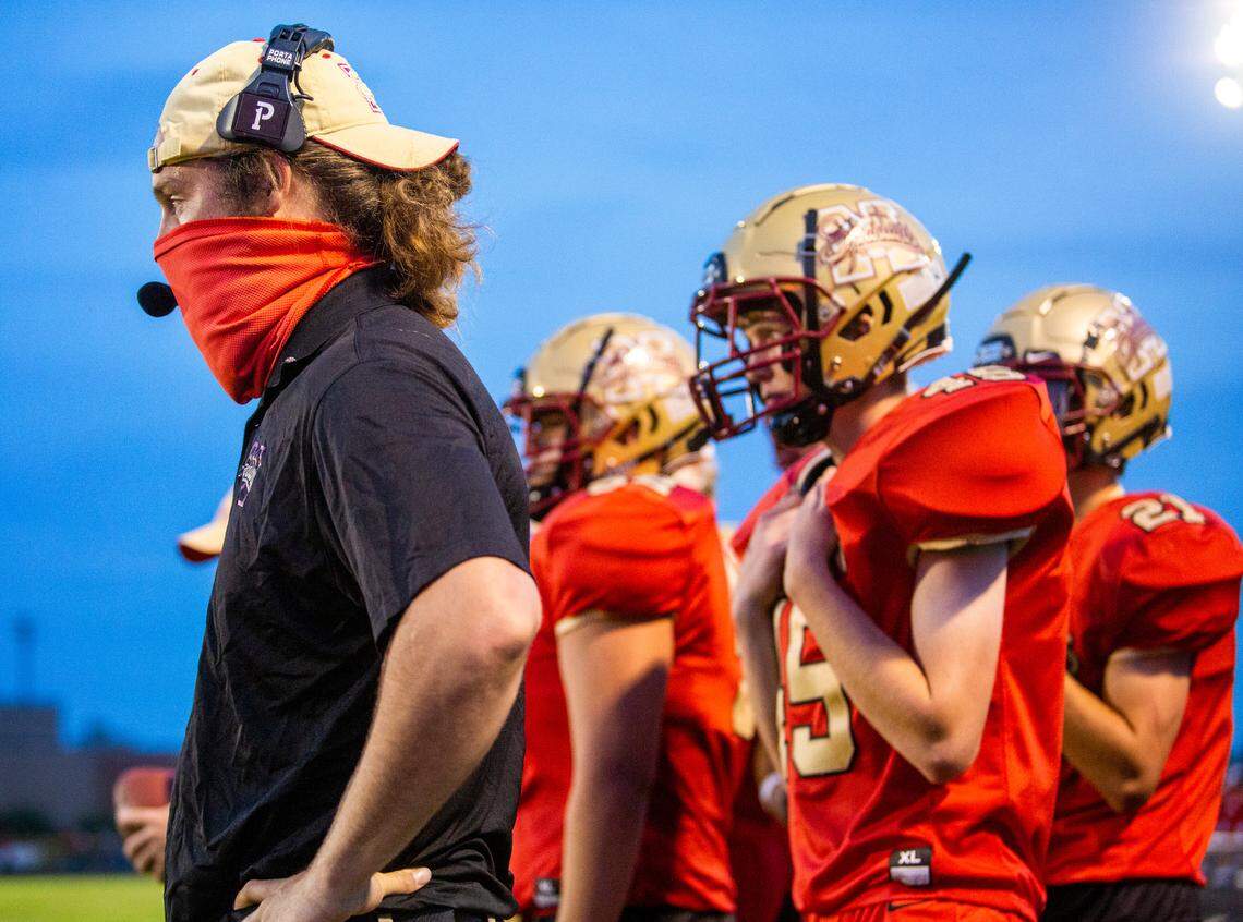 Centennial announced former Minico coach Keelan McCaffrey, left, as its next football coach.