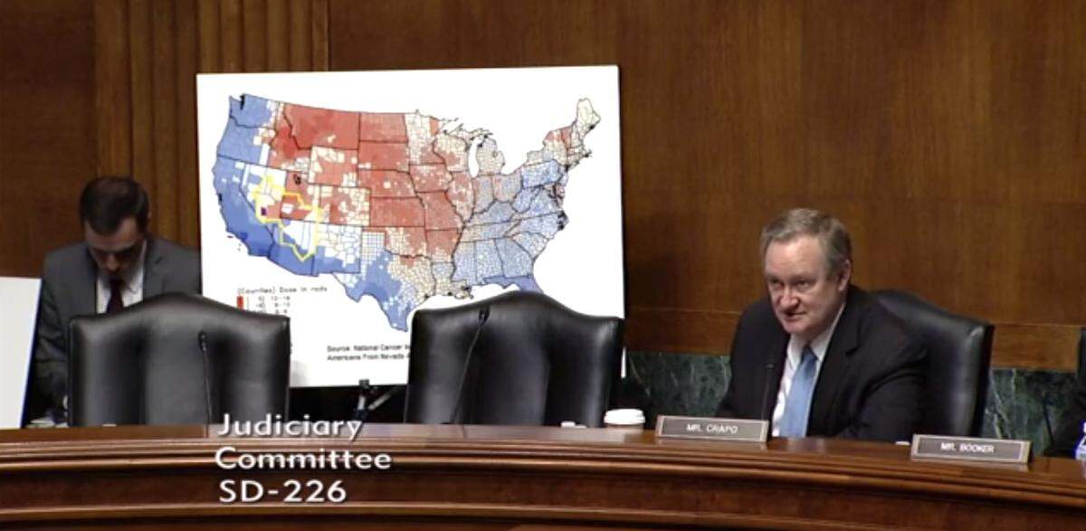 Sen. Mike Crapo, R-Idaho, displays a map of the estimated spread of radiation from 1950s American nuclear tests during a June 27, 2018 hearing on expanding compensation to people exposed to that radiation.