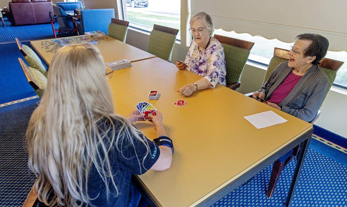 Staff member Sandra McIntosh, left, plays the game Uno with residents Dorothy Benson, center, and Mary Johnson, right, at Table Rock Senior Living At Park Place in Nampa, Friday, August. 29, 2025. 
