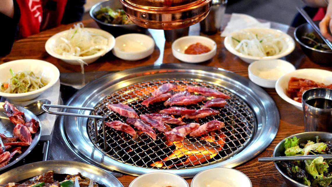 Toss on more meat! The food sizzles in the center of your table at Ombu locations in Utah.