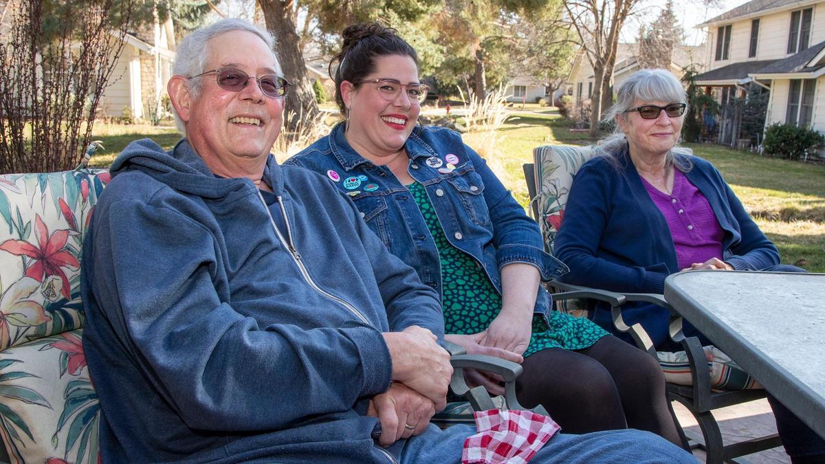 After a year of isolation during the coronavirus pandemic, Erin Riley, center, sits with her parents Jim Bigelow and Sheila Ames—comfortable and happy together after receiving COVID-19 vaccine.