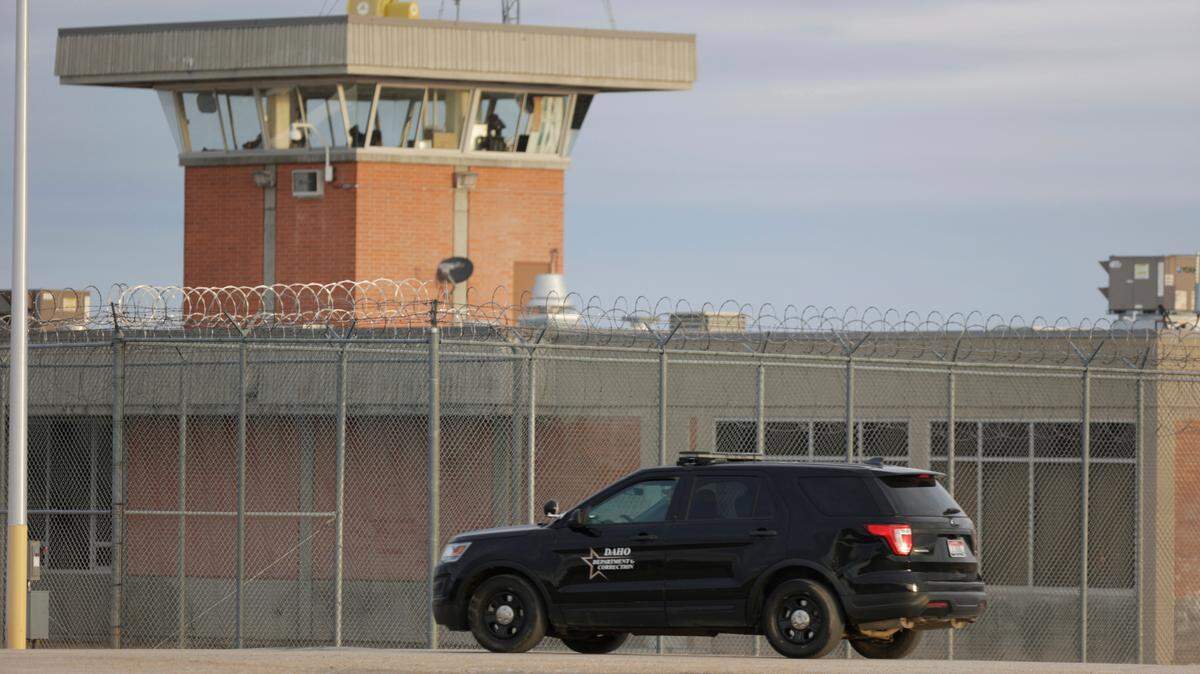 An Idaho Department of Correction vehicle patrols the Idaho State prison complex south of Boise in 2024.