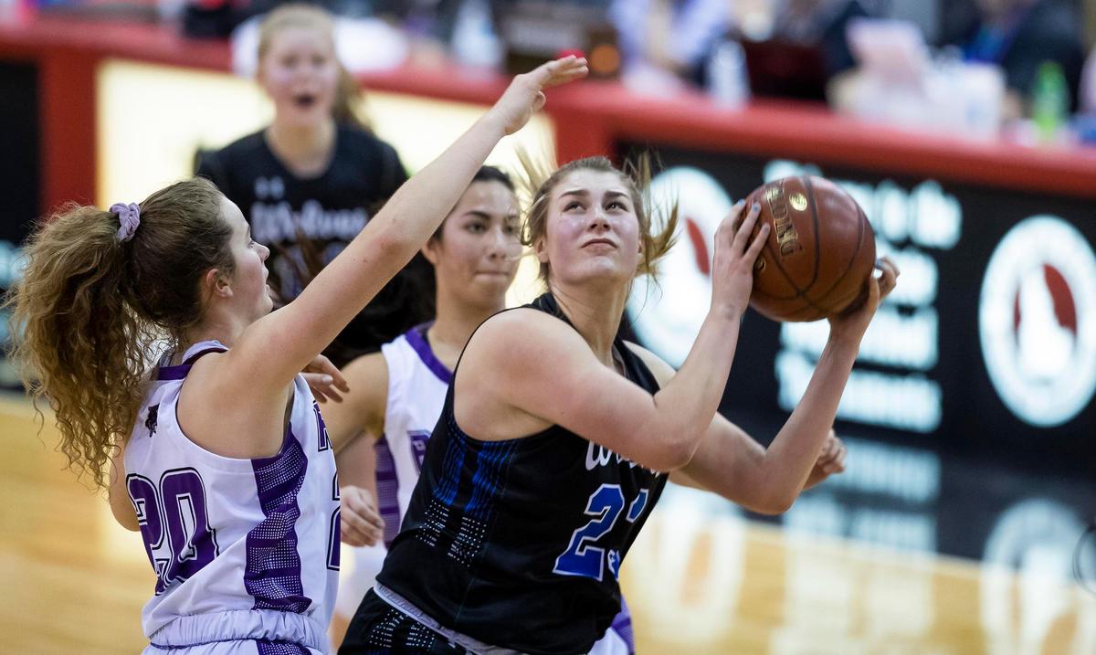 Timberline senior Emma Ellinghouse looks to score in the post defended by Rocky Mountain’s Annagail Smith in the 5A state girls basketball tournament semifinals Friday, Feb. 21, 2020 at Ford Idaho Center in Nampa.