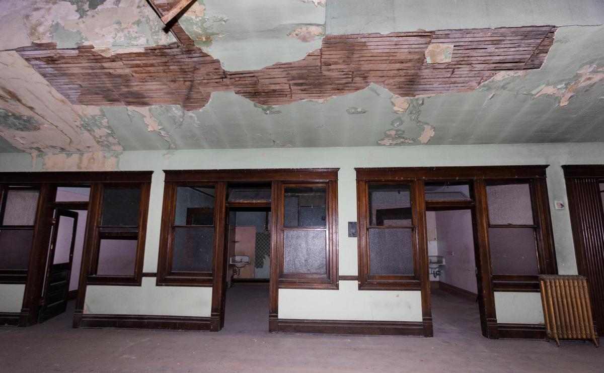 Building owner Jade Stacey plans to keep the individual rooms, complete with windows, doors, trim and transom windows, intact as much as possible, including the plaster and lath up to the arched ceiling. He’s also planning on keeping the original radiators, seen at right, for decoration. Rooms in the second floor of the Smith Block building, at 1015 W. Main St. remain in their original design from the time it was built in 1905.