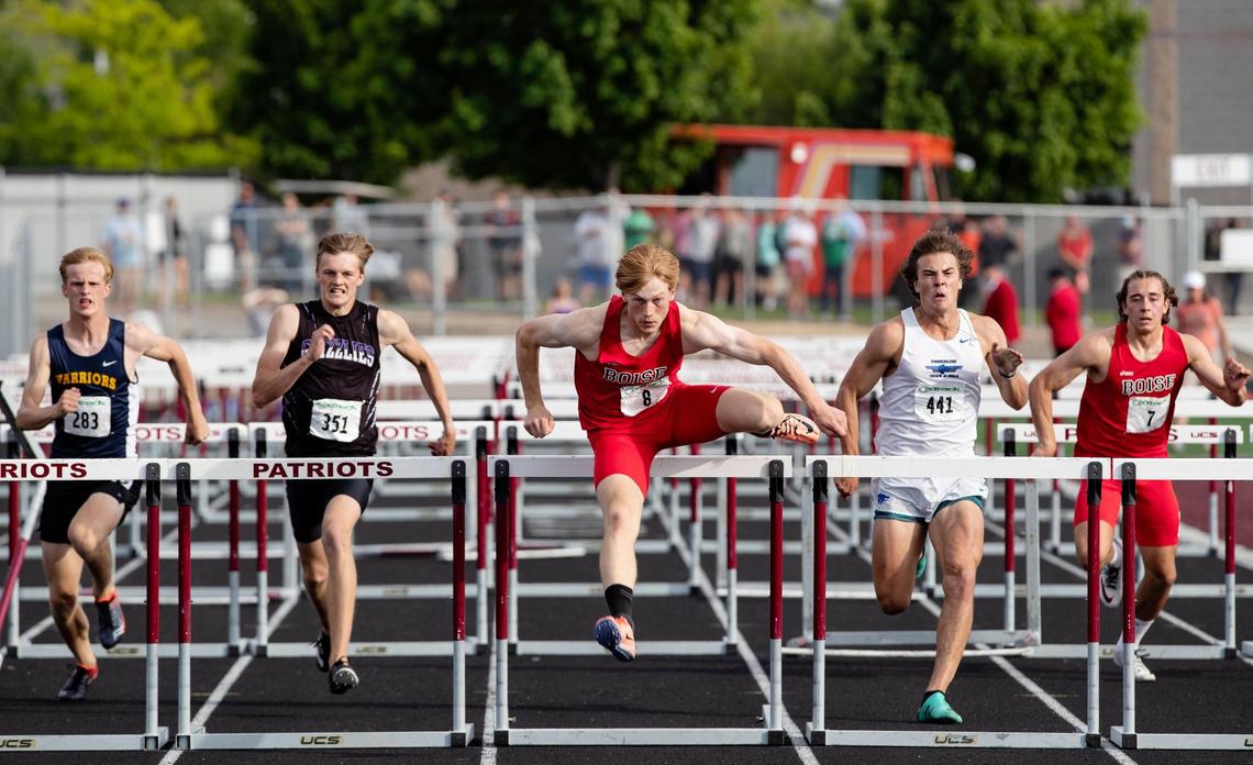 From left, Meridian’s Caleb Woodland, Rocky Mountain’s Aiden Burbank, Boise’s Anders Covey, Timberline’s Gideon Coprivnicar and Boise’s Porter Coffield battle for the 110 hurdle title at the 5A District Three track and field championships Firday at Centennial High. Covey took first place.