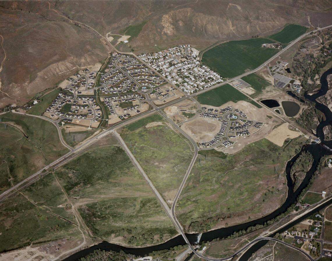 The Harris Ranch development about 2005, looking northeast. Warm Springs Avenue crosses the photo from lower left to upper right. The Spring Creek neighborhood is at the top (north), with the long-established Golden Dawn Estates mobile-home park to its right Tthe Mill Creek neighborhood is across Warm Springs to the south.  The Idaho Shakespeare Festival site is upper right.