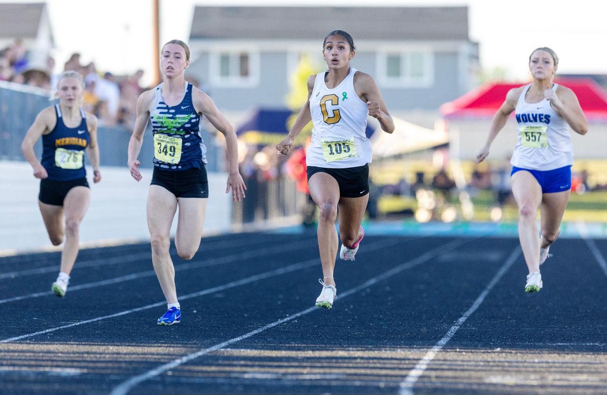 Capital’s Christine Huckins, center, set overall state meet records in both the girls 100 and 200 last season. She could do so again this weekend.