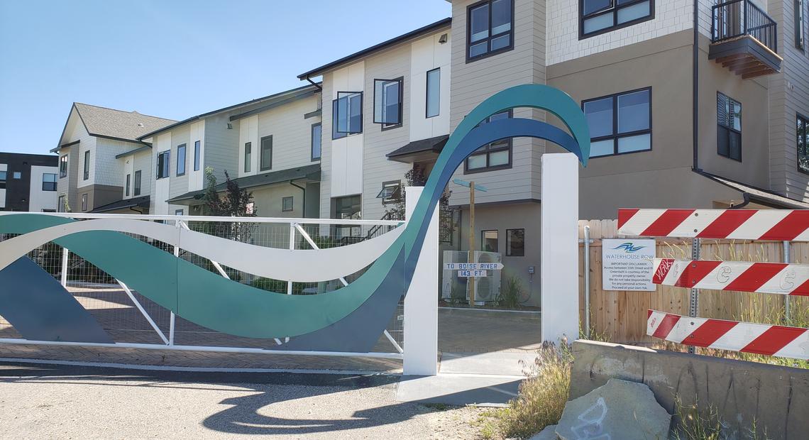 This open gate allowed walkers and bikers to move between 35th Street and the Greenbelt in Garden City. After a fence was erected, they must now go through the Waterhouse Row housing development.