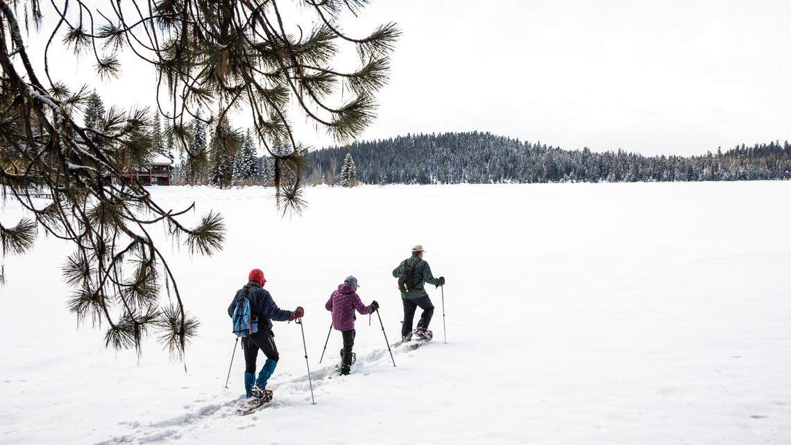 Jeff Canefield, and Edie and Thomas Welty snowshoe on Payette Lake on Parcel G, one of the endowment land sites that is part of the proposed land swap. The Idaho Department of Land rejected the proposal on Tuesday.