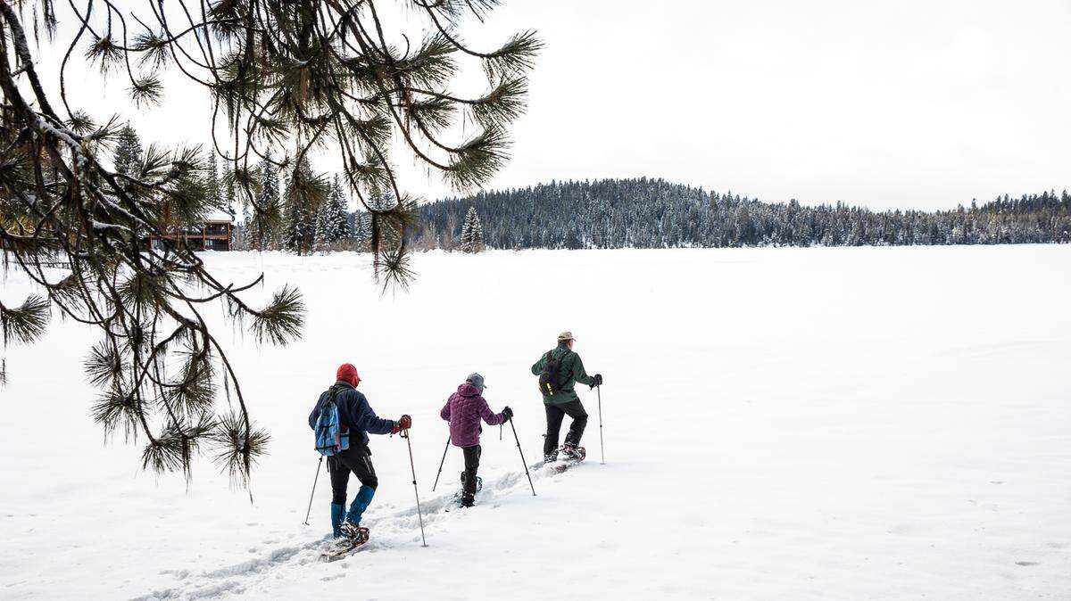 Jeff Canefield, and Edie and Thomas Welty snowshoe on Payette Lake on Parcel G, one of the endowment land sites that is part of the proposed land swap. The three are part of a local group working to stop the exchange of lands that surround much of the lake in McCall, Idaho.