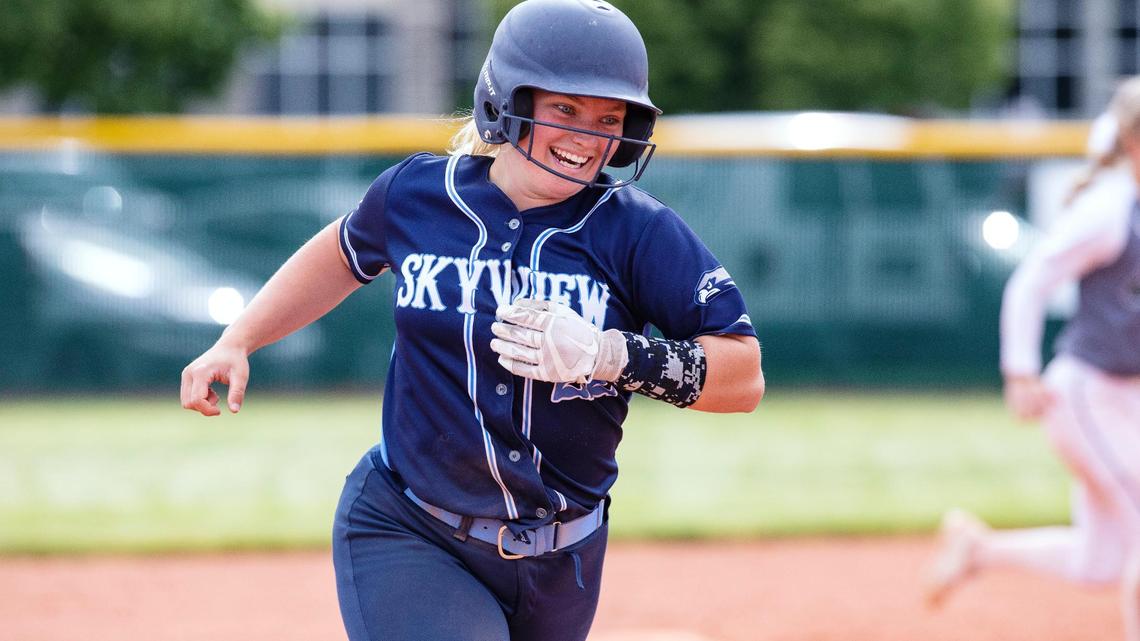 Skyview catcher Summer Makinster is all smiles as she clears the bases after hitting the ball out of the park in the Hawks’ 15-0 win over Eagle in the 5A state softball tournament Friday at Mountain View High School.