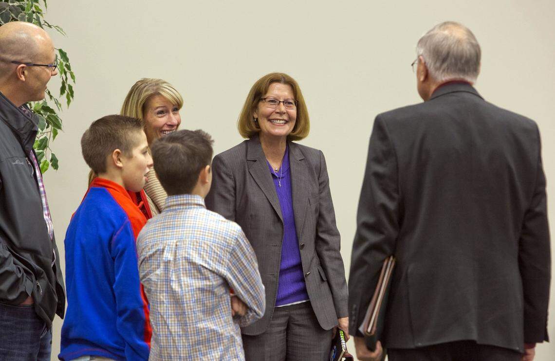 Mary Ann Ranells, then a candidate for the West Ada superintendent’s job, mingles with her daughter and family, and people who attended a special meeting of the board of trustees in December 2015 in Meridian.