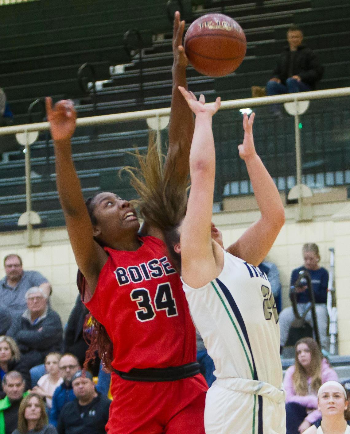 Boise senior Peyton McFarland blocks a shot attempt by Mountain View’s Trinity Slocum during the 5A District Three girls basketball semifinals Saturday, Feb. 8, 2020 at Borah High School in Boise.