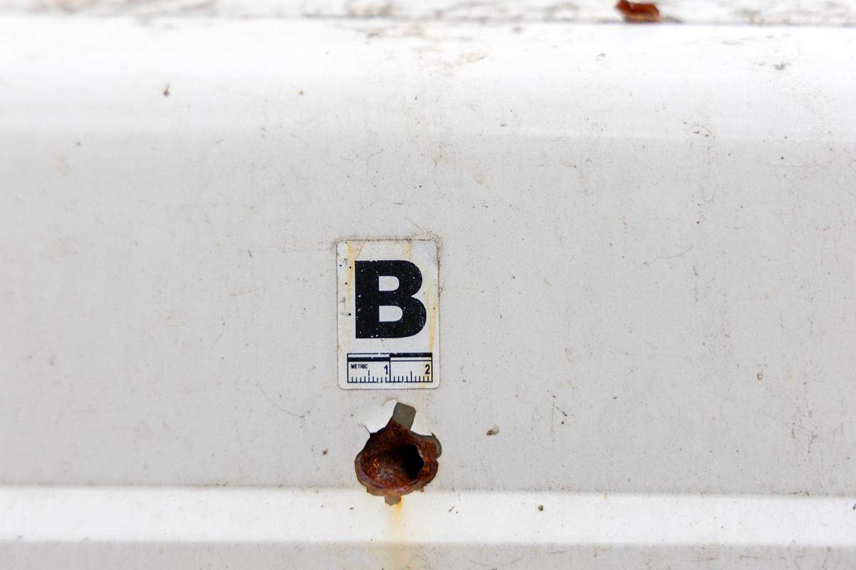 Evidence markers show where a bullet entered Levi Dorcheus’ car during a Boise police shooting in their neighborhood. Dorcheus filed a claim about the damages.